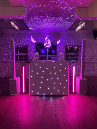 disco set-up with mirror ball and pink lighting